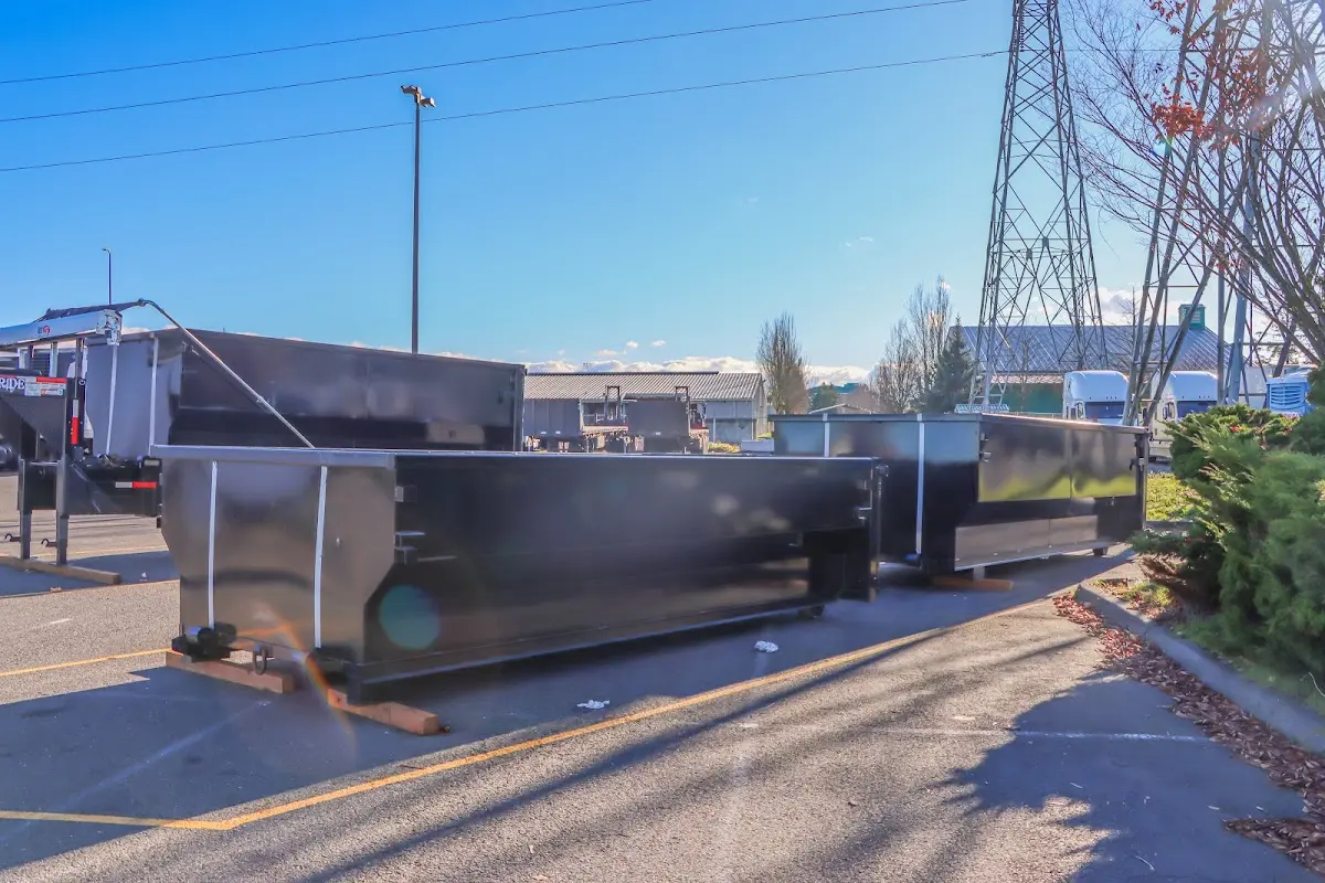 Roll-off dumpster ready for waste disposal at job site for Construction Dumpster Rental in Versailles
